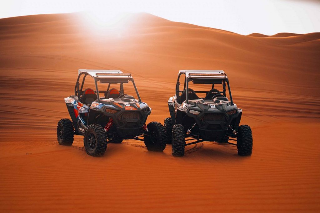 Two dune buggy vehicles ready for desert tour in Dubai home