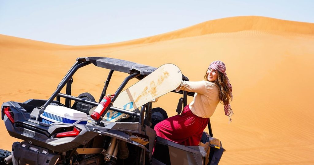 Powerful dune buggy safari dubai on the steep red dunes of Al Badayer