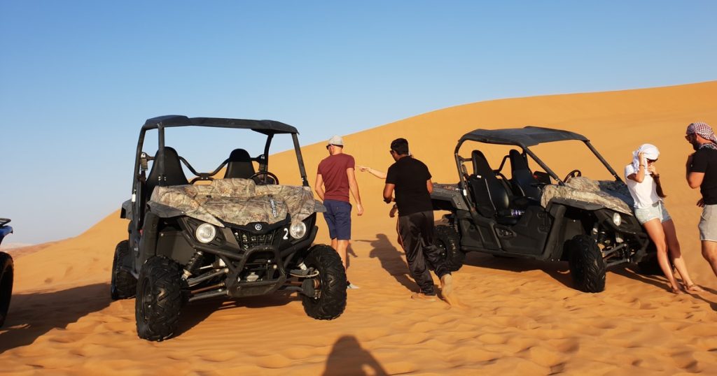4 seater dune buggy driving through Dubai desert